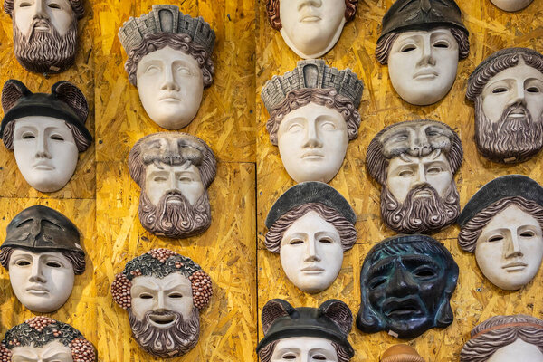 Close up view of traditional Greek theatrical and mythological masks for sale in Heraklion, Crete, Greece