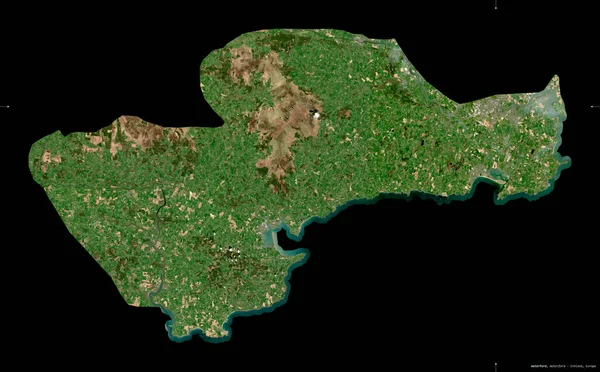 Waterford, county of Ireland. Sentinel-2 satellite imagery. Shape isolated on black. Description, location of the capital. Contains modified Copernicus Sentinel data