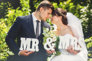 Wedding couple with signs MR and MRS clipart