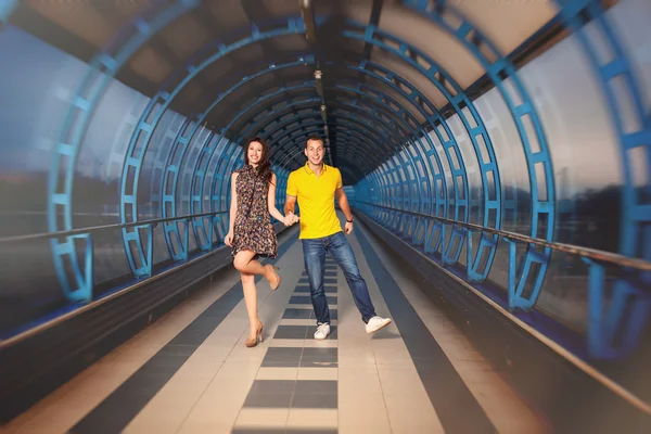 Adult couple in blue tunnel — Stock Photo, Image