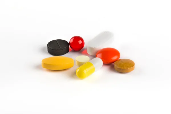 Barevné pilulky. Izolovaný — Stock fotografie