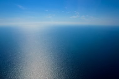 View from airplane window. The sea and the sky