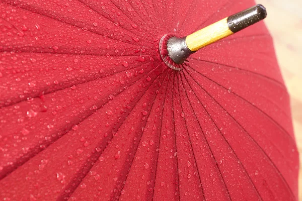 Red wet umbrella — Stock Photo, Image