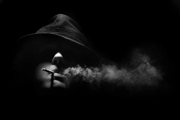 Man smoking cigarette in darkness — Stock Photo, Image