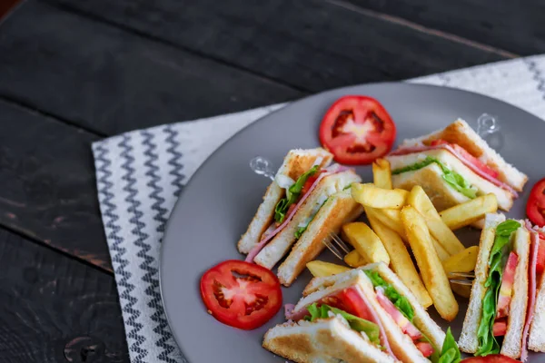 Club Sandwich Slices Laid Out Gray Plate Tomatoes Fries — Stock Photo, Image