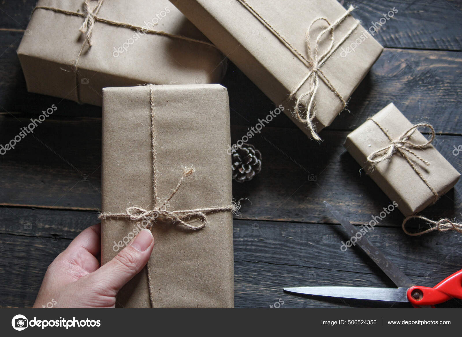 Gift wrapping from Kraft paper wrapped with twine Stock Photo by