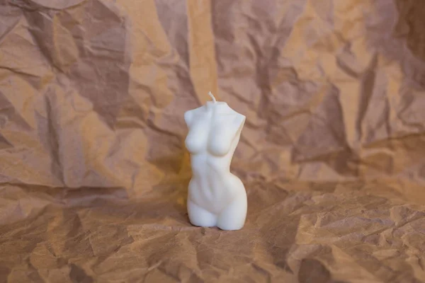 纸背上的白色蜡烛 以女性形象出现 — 图库照片
