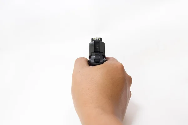 Mão segurar e apontar pistola automática isolada no fundo branco — Fotografia de Stock