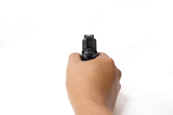 Mão segurar e apontar pistola automática isolada no fundo branco — Fotografia de Stock