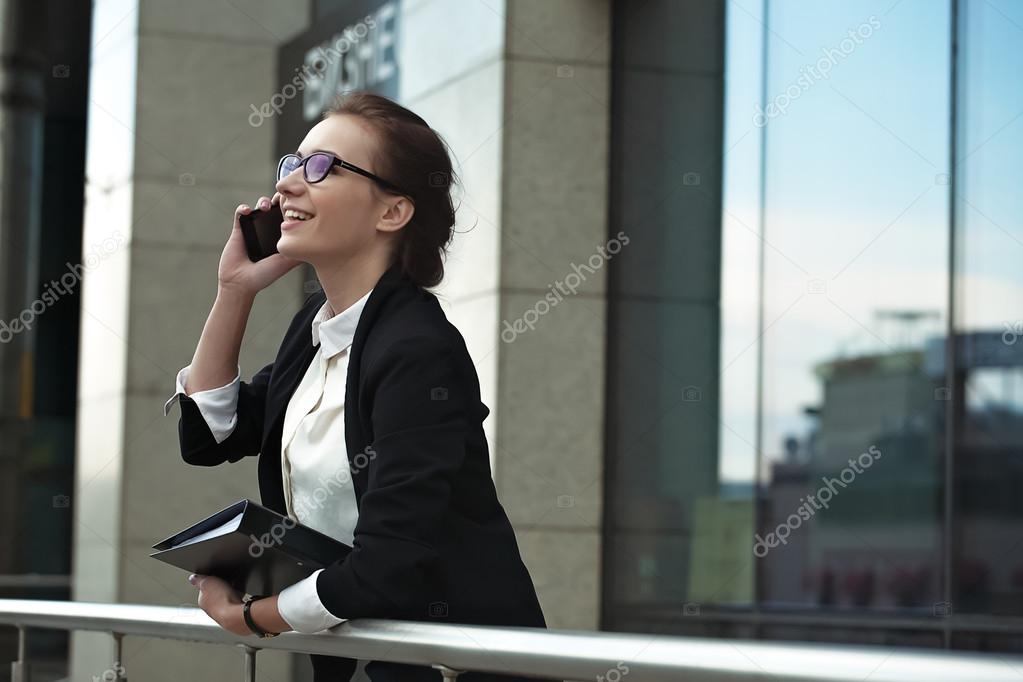 Professional manager lady with phone and documents.