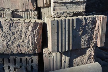 Construction and renovation, historical materials. Red, beautiful, old factory-made building bricks for interior wall cladding in factories, plants and industrial buildings.