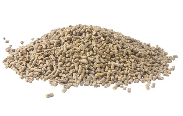 Slide granulated chicken feed isolated on white background — Stock Photo, Image