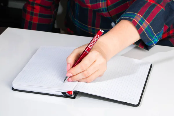 Young Woman Holds Pen Her Left Hand Writes Note Blank — Stock Photo, Image