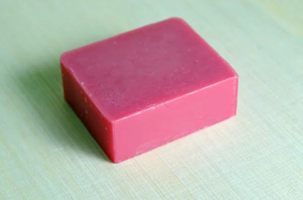 Soap bar flavor with rose ingredient isolated on wooden board ba — Stock Photo, Image