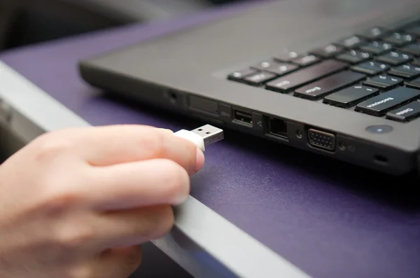 Virus USB thumb drive plug in to laptop computer port — Stock Photo, Image
