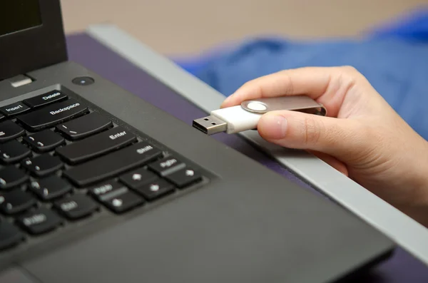 Virus USB thumb drive plug in to laptop computer port — Stock Photo, Image