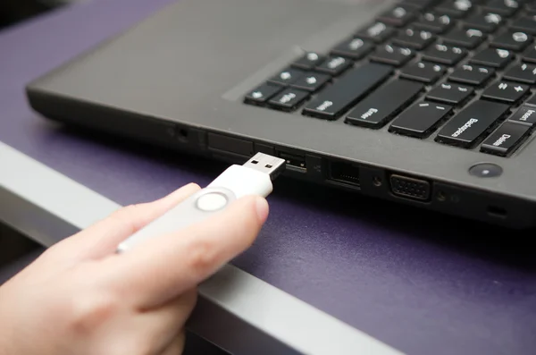 Virus USB thumb drive plug in to laptop computer port — Stock Photo, Image