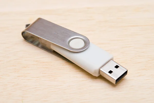 Blank USB thumb drive isolated on wooden board background — Stock Photo, Image