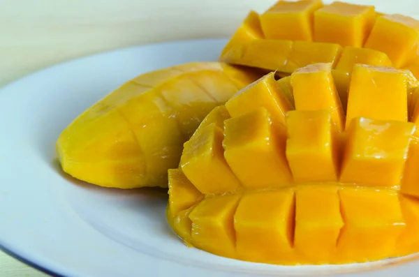 Sliced ripe yellow mango on the plate — Stock Photo, Image
