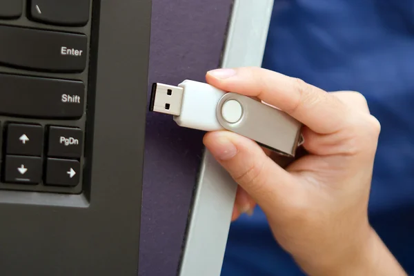 USB stick or USB thumb drive with virus plug in to laptop comput — Stock Photo, Image