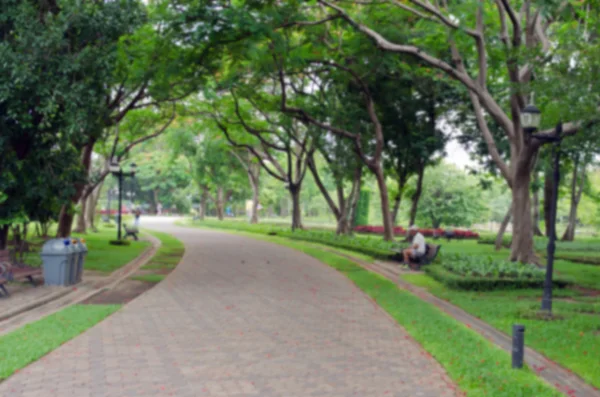 People relax in park and garden with blurred view — Stock Photo, Image