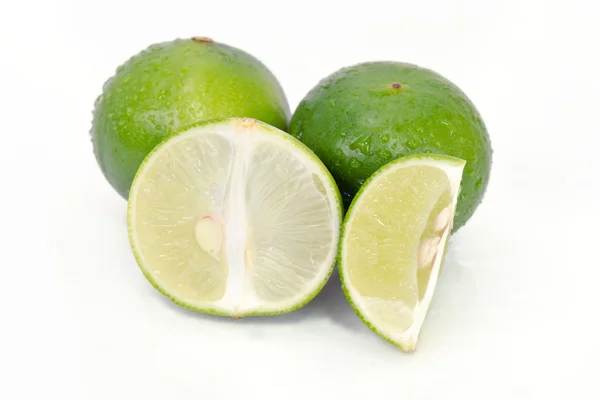 Owoc cytryny lub limonki z pół krzyż punkt i częściowe — Zdjęcie stockowe