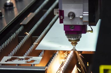 The fiber laser cutting machine cutting  machine cut the metal plate. The hi-technology sheet metal manufacturing process by laser cutting machine.  clipart