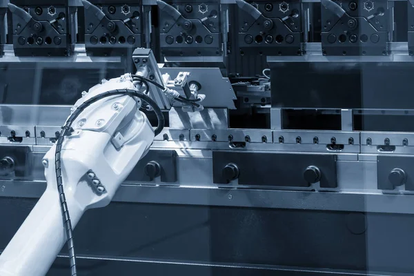 The robotic arm operation at hydraulic bending machine. The hi technology sheet metal forming process by robotic system.