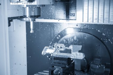 The 5-axis machining center cutting the aerospace part with indexable tool. The hi-precision manufacturing process by multi-axis CNC milling machine.