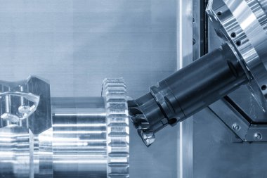 Birden fazla eksen işletimini entegre eden bir çoklu görev CNC makinesi (veya dönüm-değirmeni merkezi) kullanılarak vites parçaları üzerindeki uç-yüz mekanizma süreci. Anahtar, yüzleştirilecek veya oluşturulacak yüksek performanslı karpit eklentileri ile donatılmış indekslenebilir bir aracın kullanımıdır