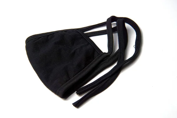 白い背景に隔離された黒い布のマスク — ストック写真