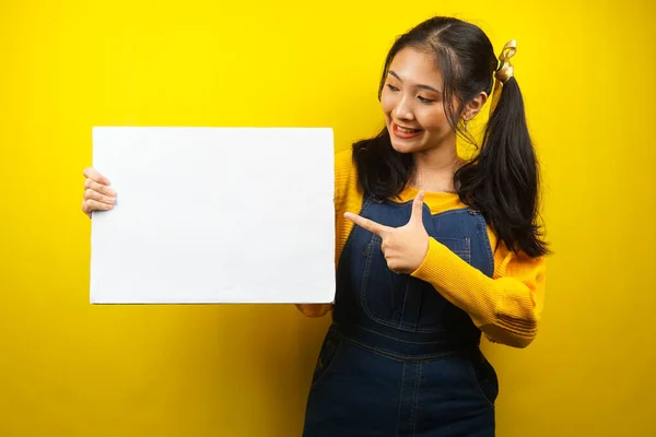 stock image Pretty and cute young woman cheerful holding blank empty banner, placard, white board, blank sign board, white advertisement board, presenting something in copy space, promotion