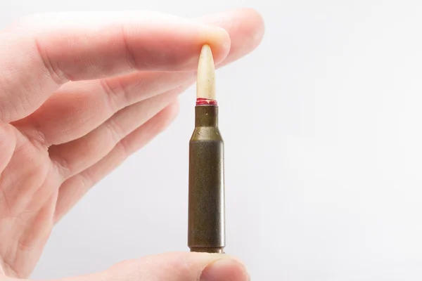 Riffle bullet in a hand — Stock Photo, Image