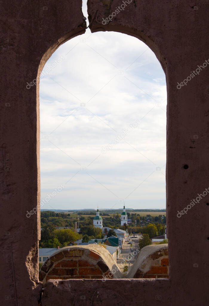 view of the city through the window of the old tower