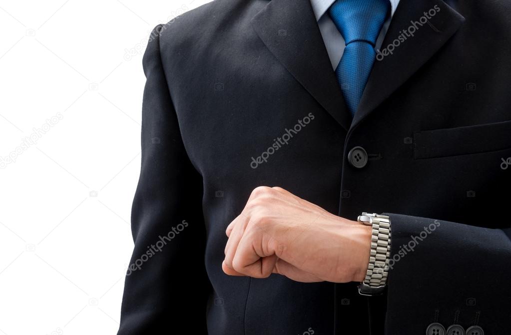 Business man looking his watch to check time