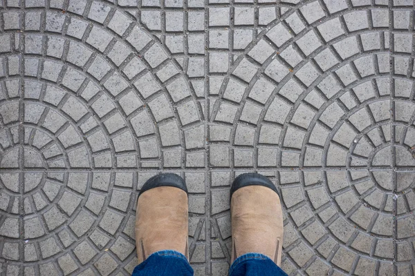 Brown suede shoes standing on tiled floor — Stock Photo, Image