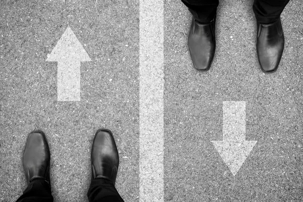 Two men standing on different side of the road — Stock Photo, Image