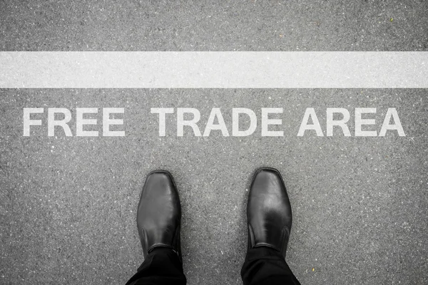 Black shoes standing at free trade area — Stock Photo, Image