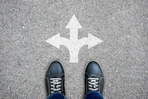 Black casual shoes standing at the three ways crossroad — Stock Photo, Image