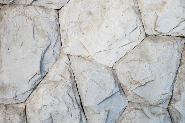 Arka plan olarak ayrıntılı olarak taş duvar