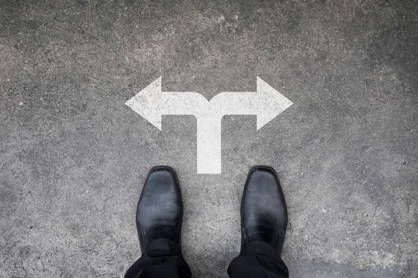 Black shoes standing at the crossroad — Stock Photo, Image