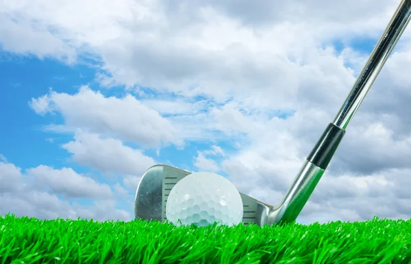 Golf ball and iron club — Stock Photo, Image