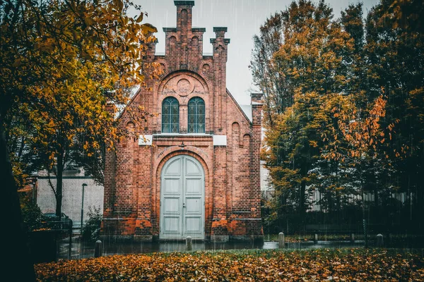 Old university building in Sweden on a wet rainy autumn day