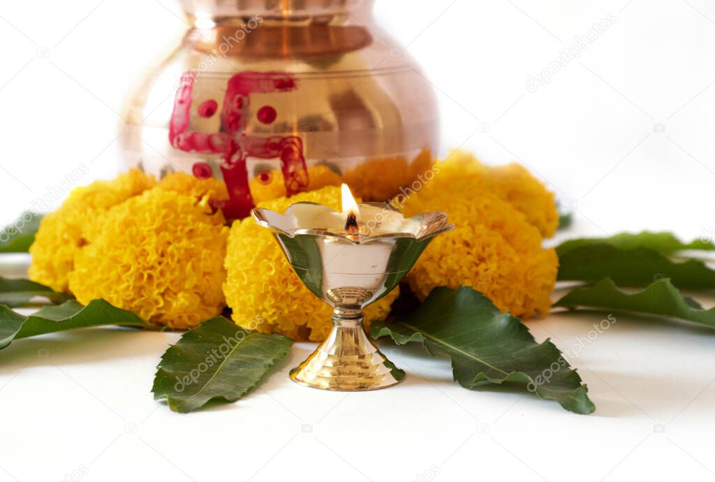 kalash pujan Indian festival akshaya tritiya Decorative kalash with coconut and leaf with floral decoration