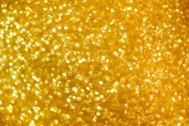 Soyut parıltılı ışıkların arkaplanı. Altın. Odaklanamıyorum. Pankart