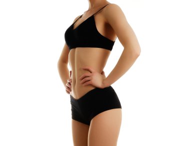 Beautiful slim female body. Voluptuous woman's shape with clean healthy skin, flat stomach. Spa beauty part of body. Perfect female body isolated on white background