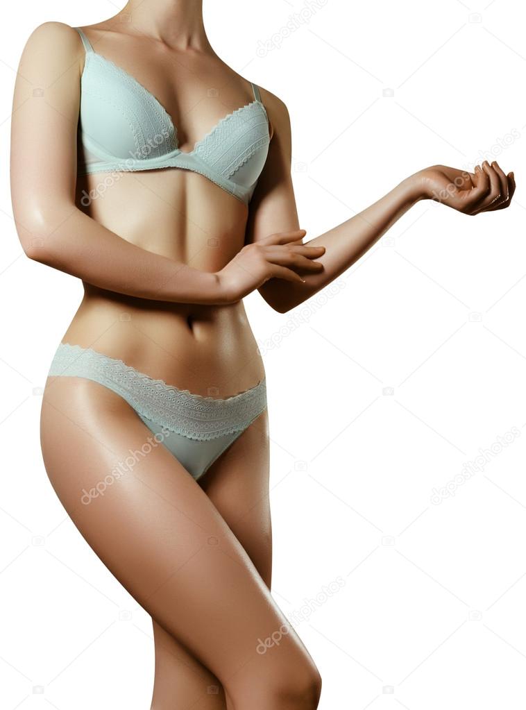 Sexy body of a beautiful woman. Beautiful woman body. Perfect shining skin  for summer. Slim tanned woman's body. Isolated over white background.  Beautiful sexy female slim tanned body Stock Photo by ©looking_2_the_sky