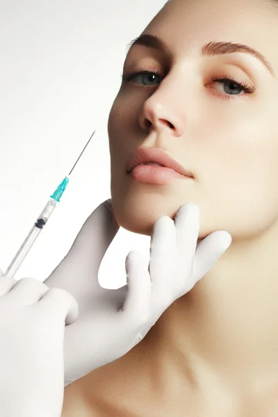 Portrait of young  woman getting cosmetic injection. Closeup of beautiful woman gets injection in her face. Filler injections.  Lip augmentation. Beautiful perfect lips — Stock Photo, Image