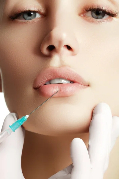Portrait of young  woman getting cosmetic injection. Closeup of beautiful woman gets injection in her face. Filler injections.  Lip augmentation. Beautiful perfect lips — Stock Photo, Image
