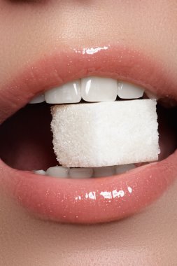 Sexy woman's lips. Beauty pale lips make-up. Beautiful make-up. Sensual open mouth. Lipstick and lip gloss. Natural full lips.